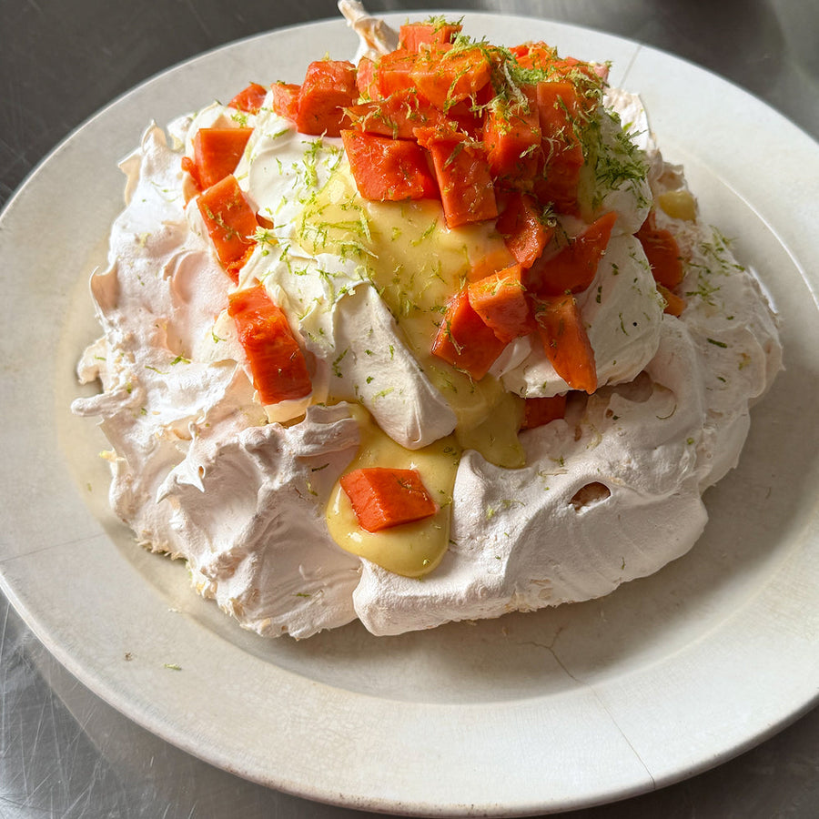 Coconut pavlova with lime curd, papaya &amp; whipped cream by Kitty Coles